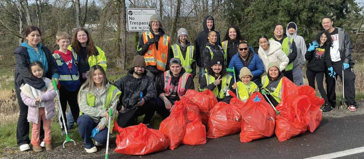 UNFI associates volunteering at a trash cleanup event.