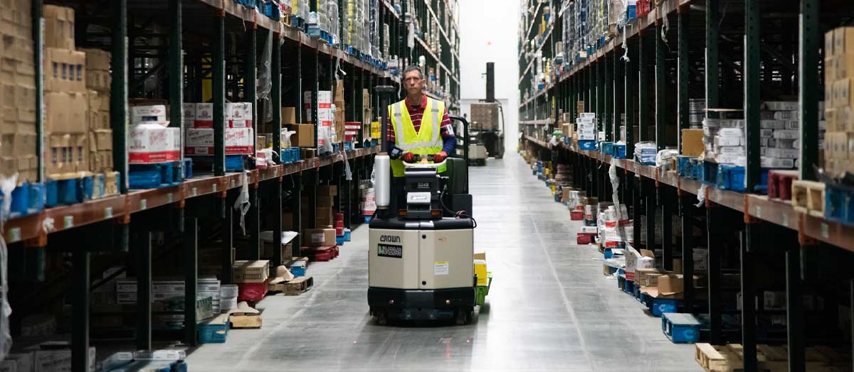 UNFI Warehouse employee on forklift