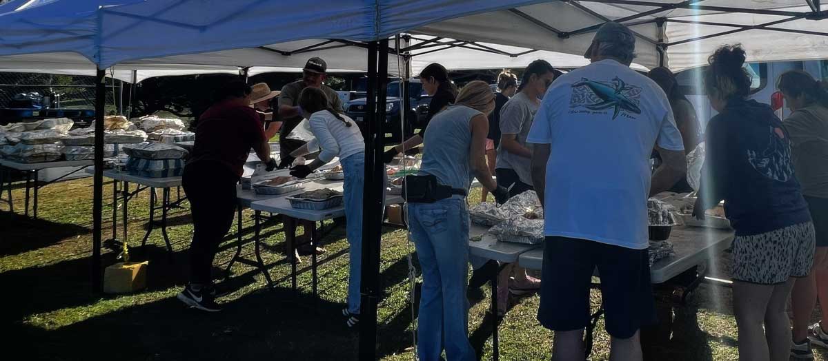 Common Ground workers picking up debris on Maui