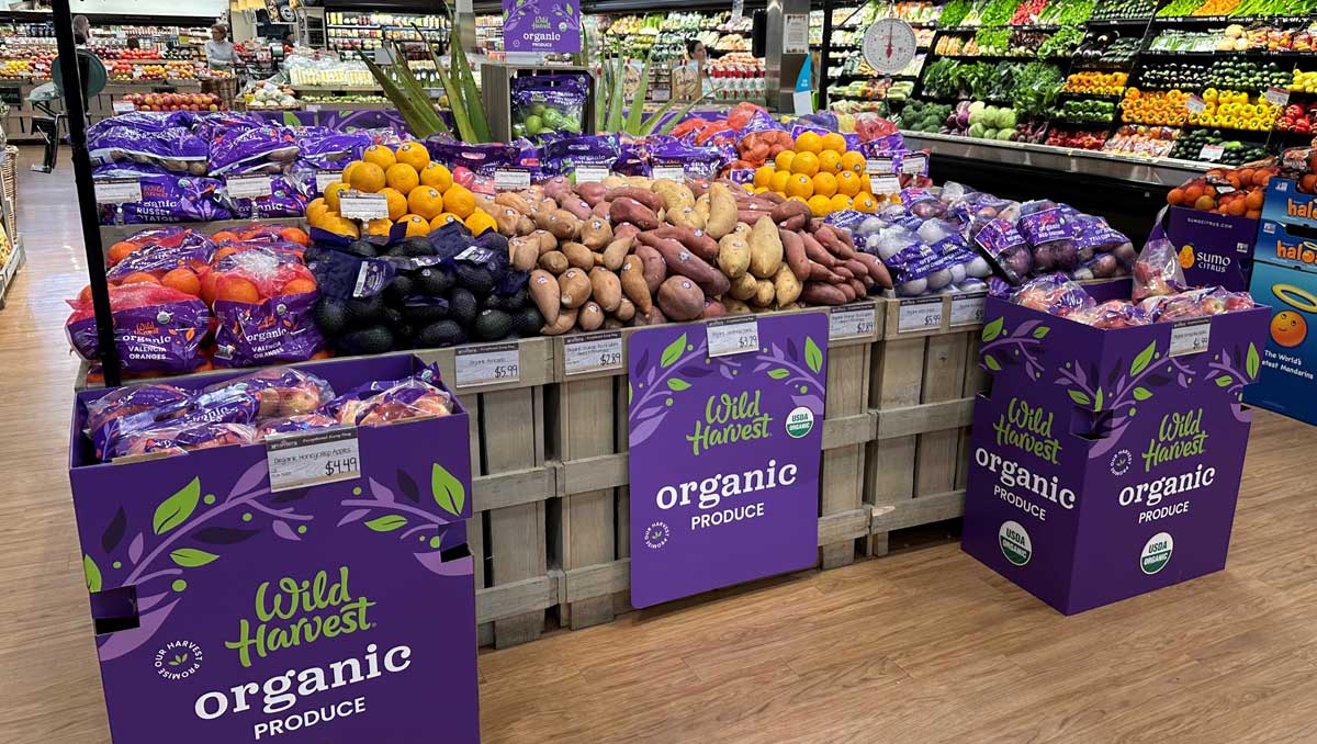 wild harvest organic produce display in grocery store