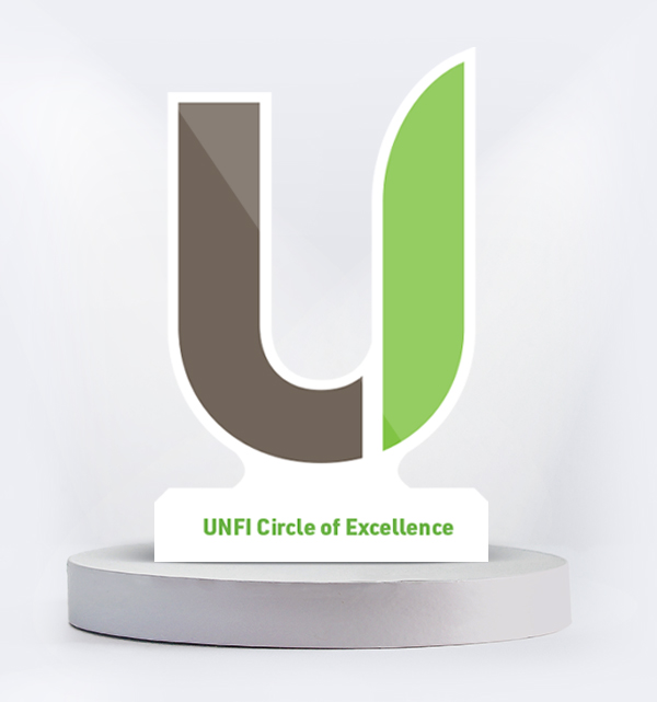 UNFI Customer of Excellence Award on a pedestal
